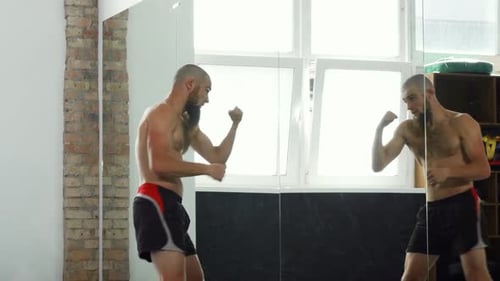 Bearded Male Mma Fighter Working Out at the Gym