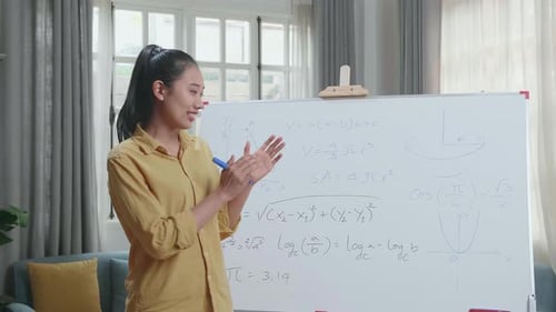 Young Woman Teaching Math in Bright Home Classroom