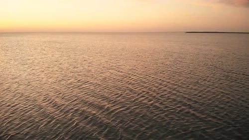 Empty Pier with Viewing Point Over Tranquil Ocean at Sunset