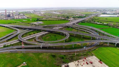 Aerial View of Complex Highway Interchange in Green Landscape