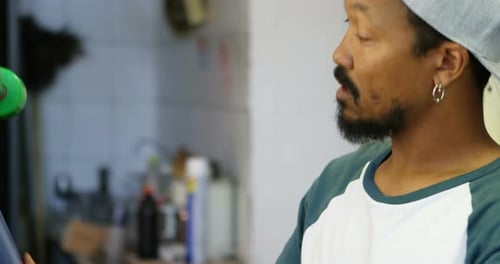 Man checking skateboard