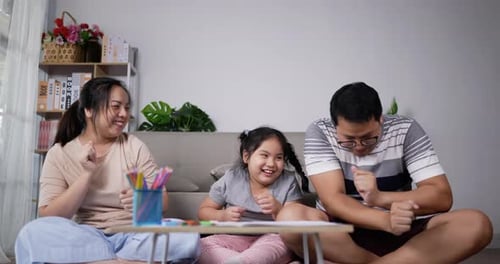 Family Dancing Together at Home