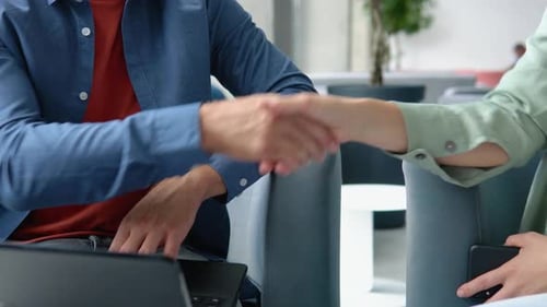 Closeup of Shaking Hands After a Business Meeting in the Office