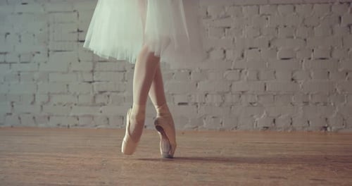 Dancer in Pointe Crosses Her Legs and Makes an Attitude