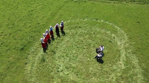 Women in Folk Costume Dancing in a Circle