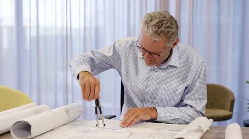 Architect working on blueprint