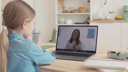 Girl Studying Online with Tutor on Laptop