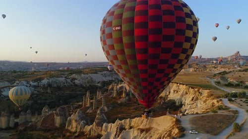 Scenic Desert Landscape with Colorful Hot Air Balloons