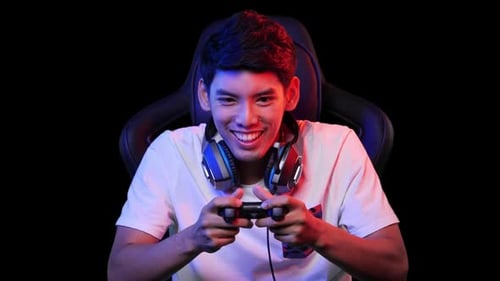 Young Man intensely playing a game with controller
