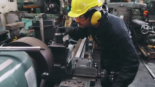 Smart Factory Worker Using Machine in Factory Workshop
