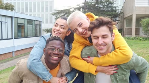 Diverse Young Friends Piggybacking, Smiling Outdoors