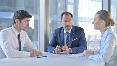 Business Team Collaborating in Modern Office Meeting