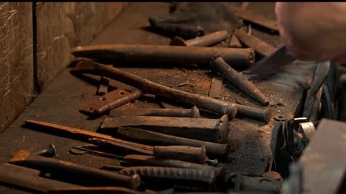 Working Metal Tools in Blacksmiths Workshop