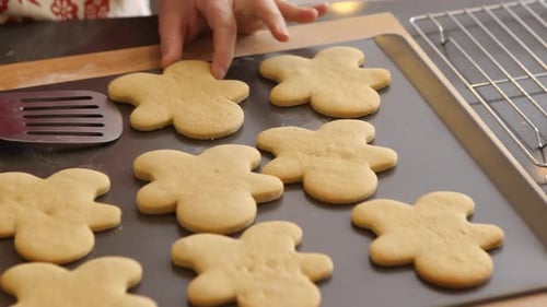 Moving gingerbread cookies to cooling rack