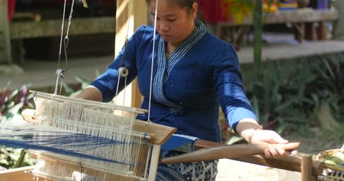 Woman Weaving Silk On Loom