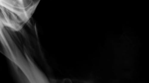 White Smoke Wisping on Black Background