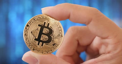 Holding Bitcoin, Close Up on Digital Currency