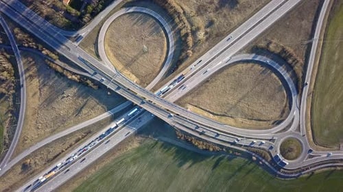 Aerial View of Freeway Intersection with Moving Traffic Cars
