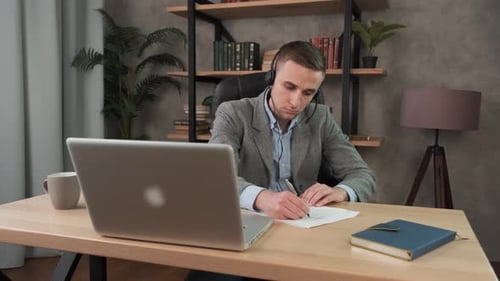 Young Adult Working Remotely from Home Office