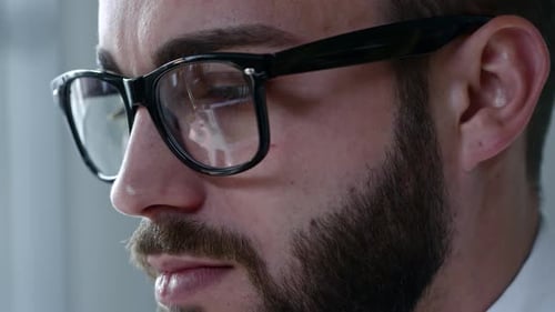 Man Wearing Glasses Working on Computer Close Up
