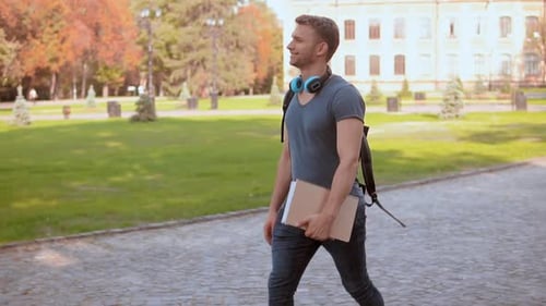 Caucasian Student s Walks in City Park