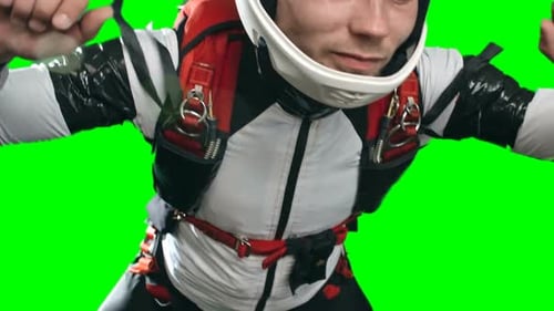 Young Adult in White Suit Posing on Green Screen