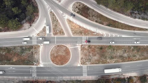 Crossing multiple lanes highway with car traffic in rush hours.