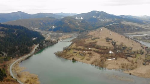 Mountain Lake in Cloudy Weather Removed From the Drone. Beautiful Autumn Landscape with Forest