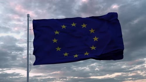 Waving European Union Flag Against Dramatic Cloudy Sky