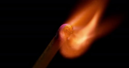 Match Ignites with Fiery Flame in Macro Shot