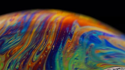 Vibrant Soap Bubble Patterns with Swirling Colors