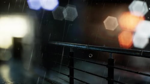 Night Rain on Railing with City Bokeh Background