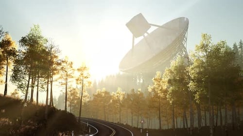 Large Satellite Dish in Forest at Sunrise with Winding Road