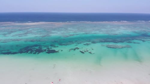 Paradise Tropical Shore and Barrier Reef in Ocean Sandbanks Zanzibar Aerial View