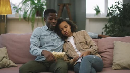 Relaxing Couple Watching Television at Home