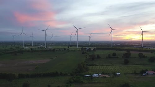 Aerial view of wind turbines or windmills farm field in industry factory. Power