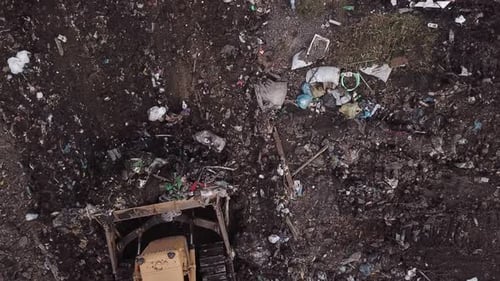 Bulldozer Moving Trash at Landfill Aerial View