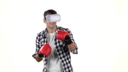 Man Boxing with VR Headset and Boxing Gloves