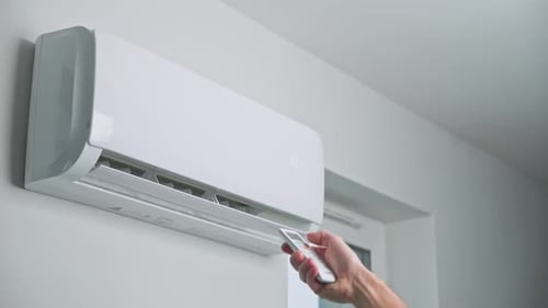 Air Conditioner Being Turned On With Remote