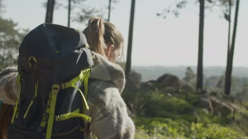 Two Young Female Friends Hiking in Countryside