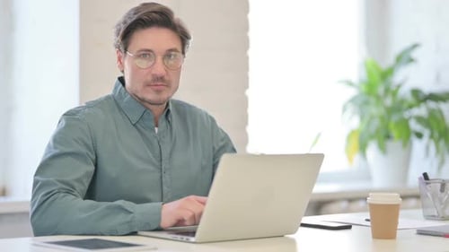No Gesture with Finger by Middle Aged Man in Office