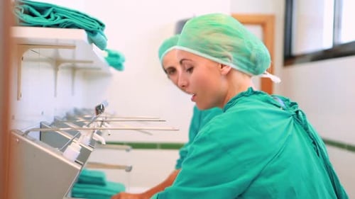Medical Professionals Washing Hands in Hospital Setting