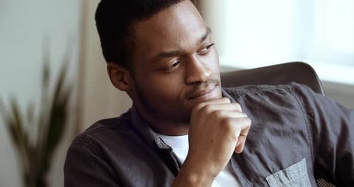 Portrait of Thoughtful Pensive Serious African American Business Man Student Sit at Home Office