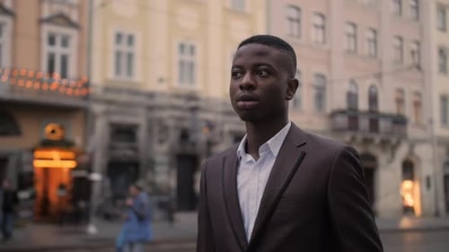 Portrait of Handsome African Man in Stylish Suit Posing on Street of City