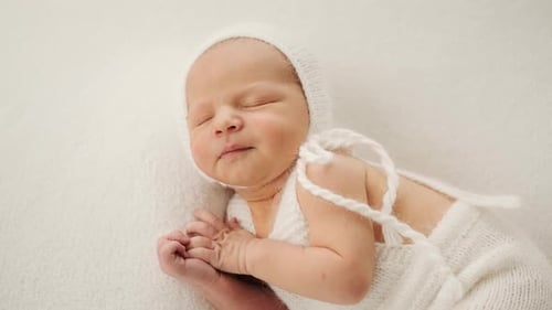 Sleeping Infant Wrapped in Soft Knitwear, Close Up