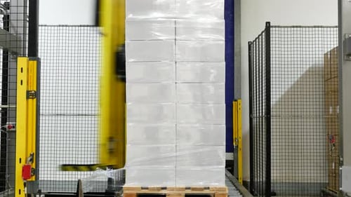 Robot packing boxes in a factory