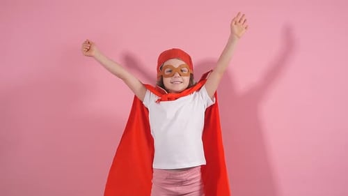 Young Girl Posing in Red Cape and Hat