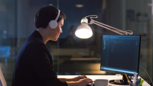 Female Programmer with Computer at Night Office 30