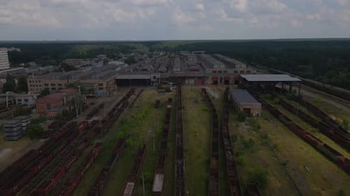 Drone is Flying Over the Tracks of an Old Train Station on the Outskirts