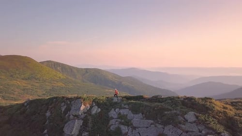Tourist Hiker with a Backpack Running on Mountain Path in Carpathian Mountains